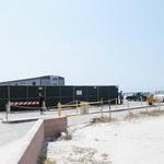 Parking Lot
 is not normally fenced off and used for temp trailer buildings as it is in this photo
