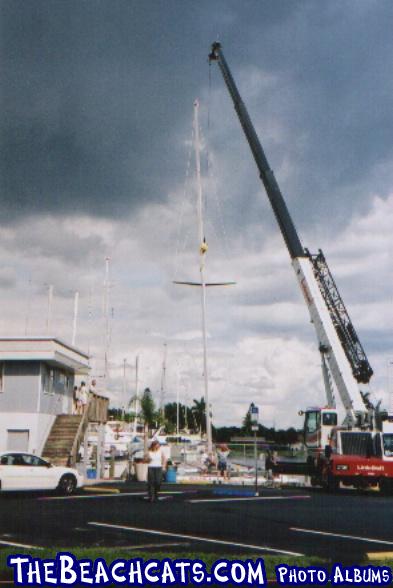 Stars and Stripes getting her new 90' carbon fiber mast at Cape Coral Yacht Club, FL. 10/03