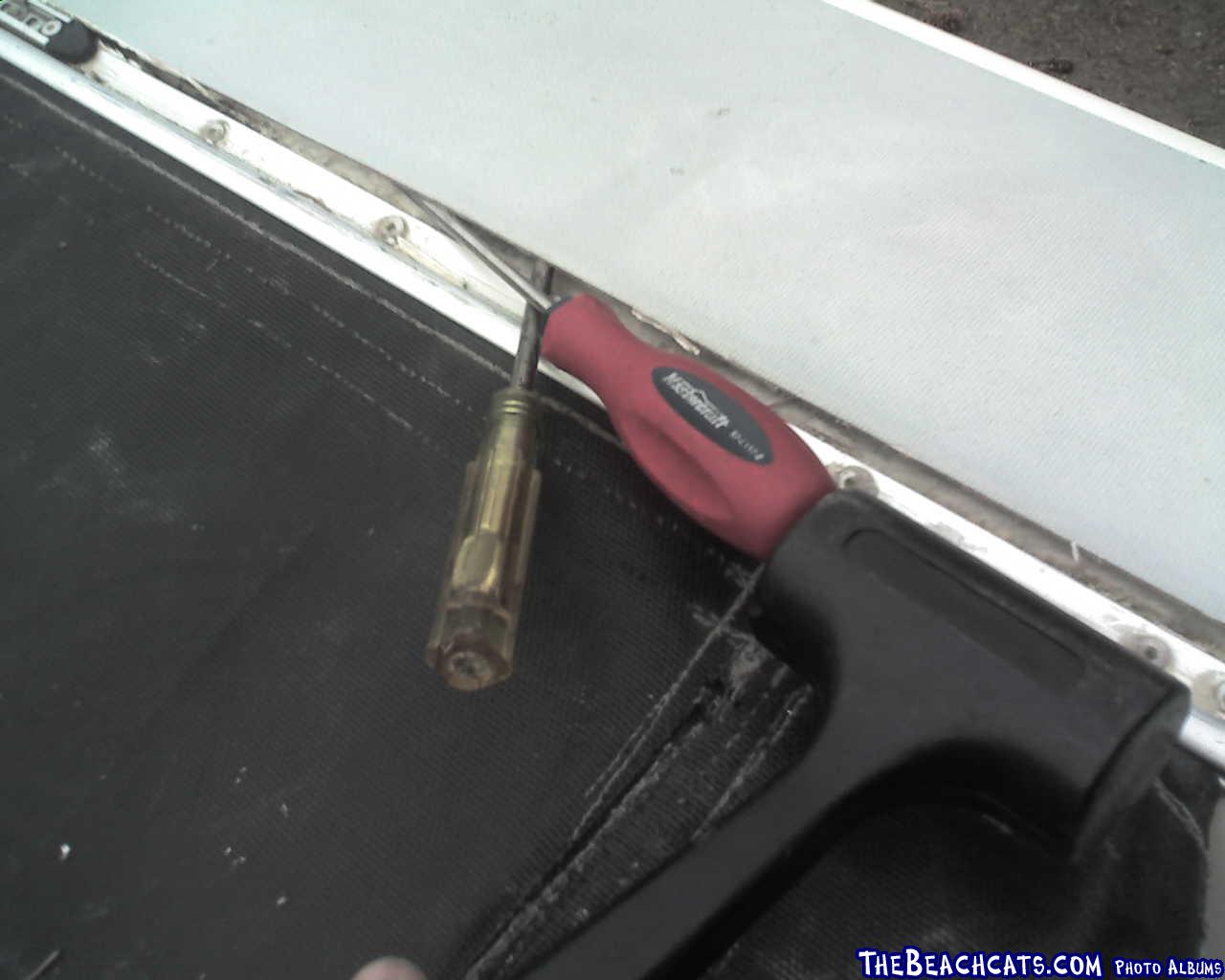 Repair 4
Using 2 screwdrivers and a hammer to continue to pry deck off. First screwdriver lifted up near the edge, the second s