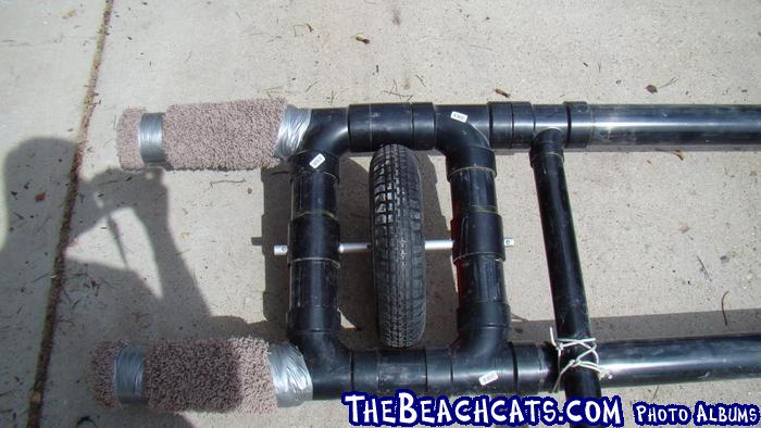 Other axle, with handle connection on rear crossbeam. 3/4" aluminum rod used for axle. Small stop screws installed on axle 