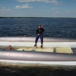 Garret Tenkel on his flipped Stiletto. She was a victim of a waterspout that ripped through the moorings in July 2006.