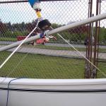Support the center of the Aluminum Spinnaker pole to stop flexing under loaded conditions.