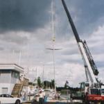 Stars and Stripes getting her new 90' carbon fiber mast at Cape Coral Yacht Club, FL. 10/03