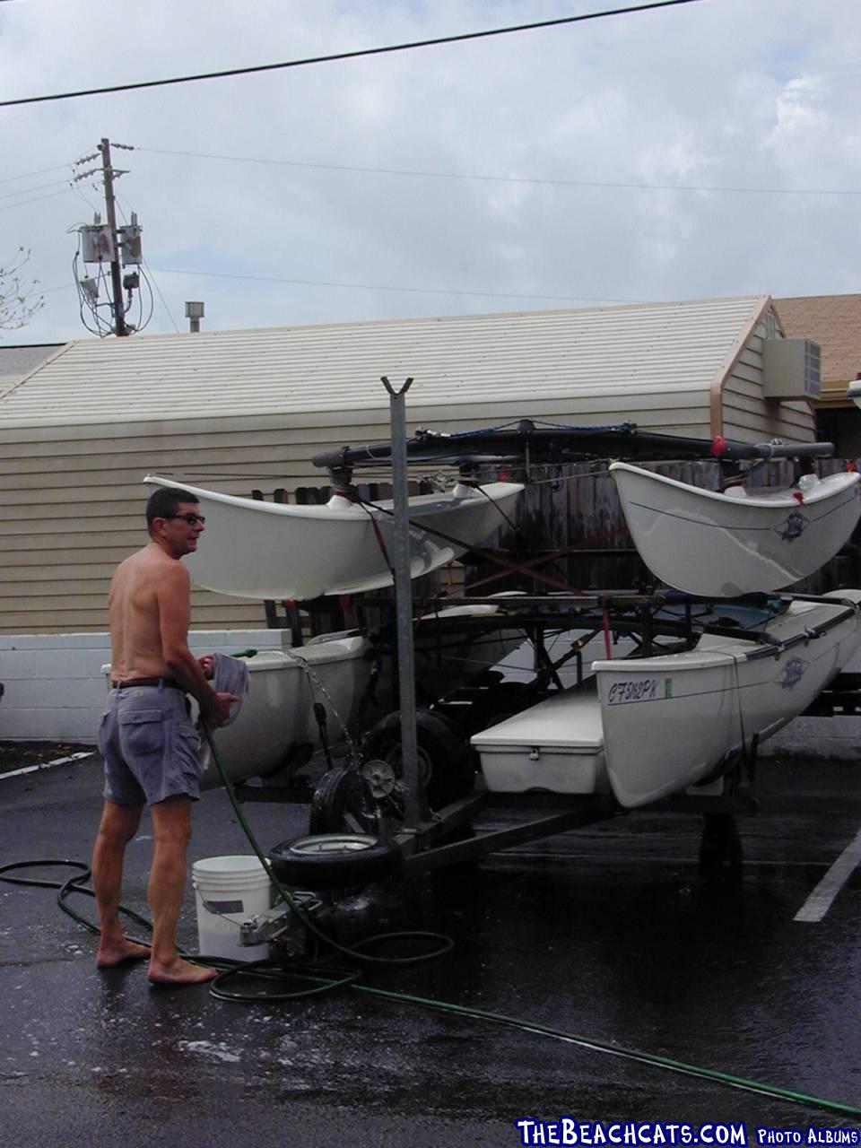 Bill washing boats after our arrival in Fort Walton Beach.